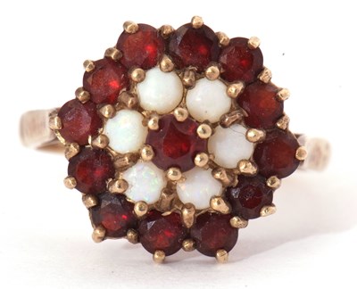 Lot 20 - Garnet and opal cluster ring, a flower head...