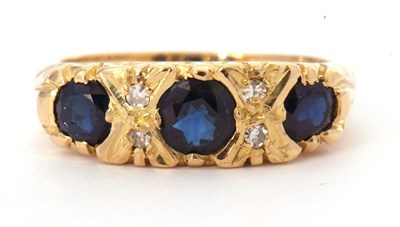 Lot 23 - 18ct gold sapphire and diamond ring featuring...