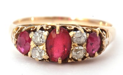 Lot 30 - Yellow metal diamond and red stone ring...