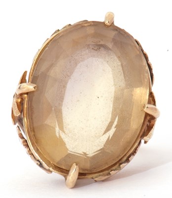 Lot 32 - Large lemon citrine dress ring, the oval...