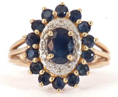 Lot 53 - Modern 9ct gold sapphire and diamond cluster...