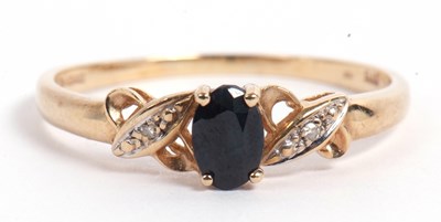 Lot 69 - Modern 9ct gold dark sapphire and diamond ring,...