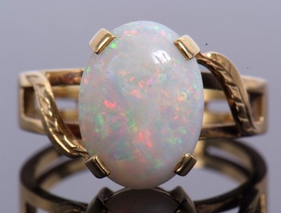 Lot 70 - Large opalescent dress ring four claw set and...