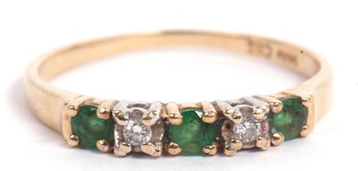 Lot 72 - Modern emerald and diamond ring, line set with...