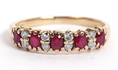 Lot 107 - Small 9ct gold ruby and diamond ring featuring...