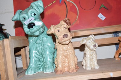 Lot 584 - THREE VARIOUS SIZED SYLVAC DOGS