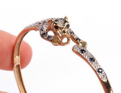 Lot 194 - Modern 9ct gold panther hinged bracelet, the...