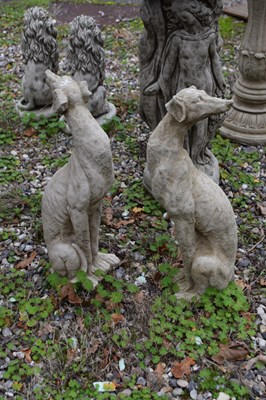 Lot 14 - Pair of composite seated whippets (small),...