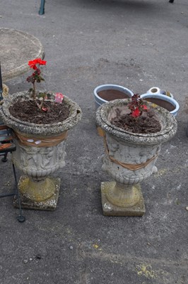 Lot 64 - Two composite garden urns/planters, height 50cm