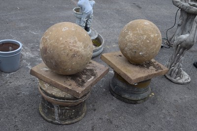 Lot 65 - Two large ball topped garden finials, height...