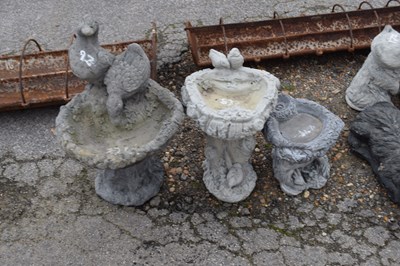 Lot 83 - Three small composite garden bird baths, the...