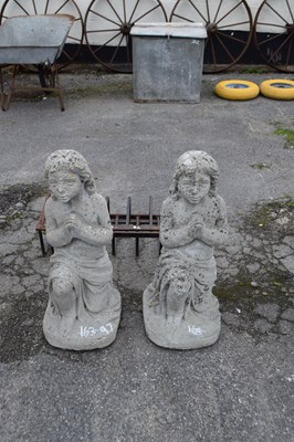 Lot 97 - Pair of composite garden statues modelled as...