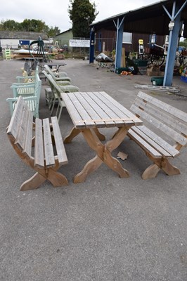 Lot 120 - Timber garden set comprising a table and two...