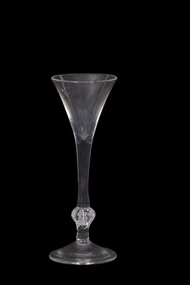 Lot 21 - A wine glass with the trumpet bowl above a...