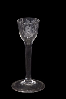 Lot 22 - A wine glass, the ogee bowl with engraved...