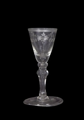 Lot 32 - Georgian wine glass with swag engraving to the...