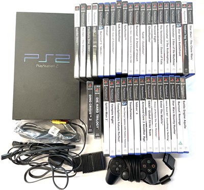 Lot 222 - A 2000 Playstation 2 console in black, power...