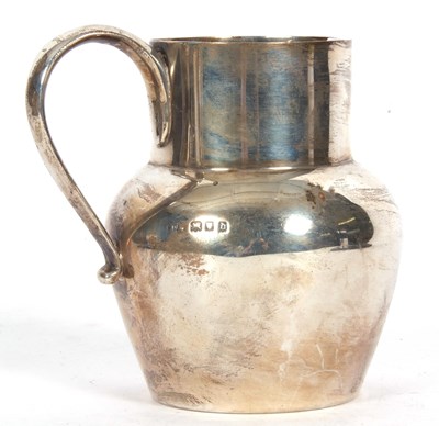 Lot 95 - George V milk jug of plain circular baluster...