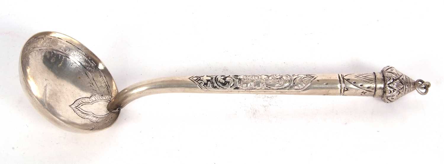 Lot 103 - North African white metal ladle with engraved...