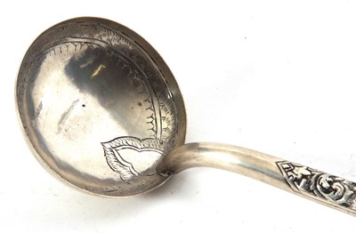 Lot 103 - North African white metal ladle with engraved...