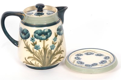 Lot 64 - MacIntyre Moorcroft Teapot and Stand