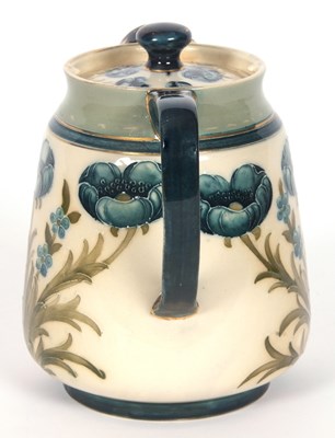 Lot 64 - MacIntyre Moorcroft Teapot and Stand