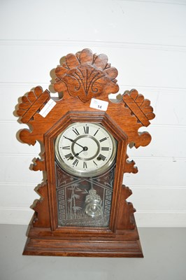 Lot 14 - Early 20th Century gingerbread mantel clock in...