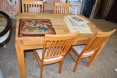 Lot 381 - Modern light oak dining table and four chairs
