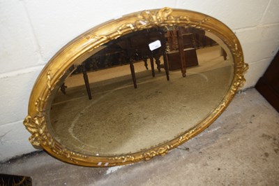 Lot 392 - 19th Century oval bevelled wall mirror in gilt...