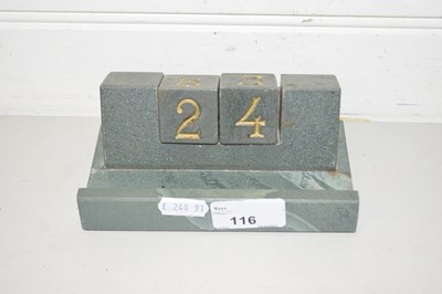Lot 116 - Polished stone perpetual calendar and pen rest