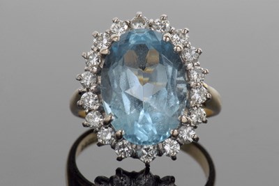 Lot 353 - 18ct gold blue topaz and diamond cluster ring,...