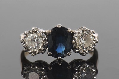 Lot 468 - Sapphire and diamond three stone ring...