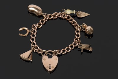 Lot 499 - Antique 9ct gold curb link bracelet suspending...