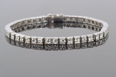 Lot 515 - Diamond line bracelet featuring forty five...