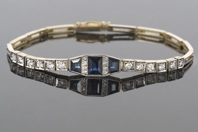 Lot 517 - Precious metal sapphire and diamond line...