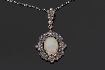 Lot 527 - Opal and diamond pendant, the oval cabochon...
