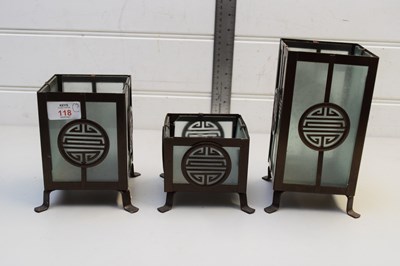 Lot 118 - FOUR MODERN METAL FRAMED CHINESE CANDLE HOLDERS