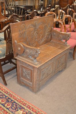 Lot 634 - Late 19th / Early 20th Century oak monks bench...