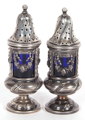 Lot 199 - A pair of continental urn shaped peppers, the...