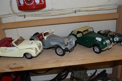 Lot 526 - Four various vintage toy cars to include Maisto
