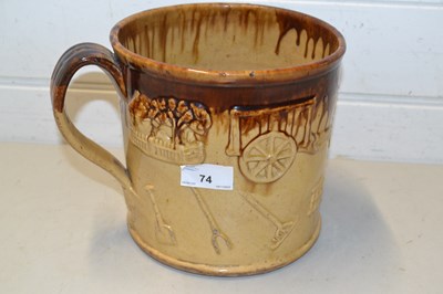 Lot 74 - Large treacle glazed tankard decorated with...