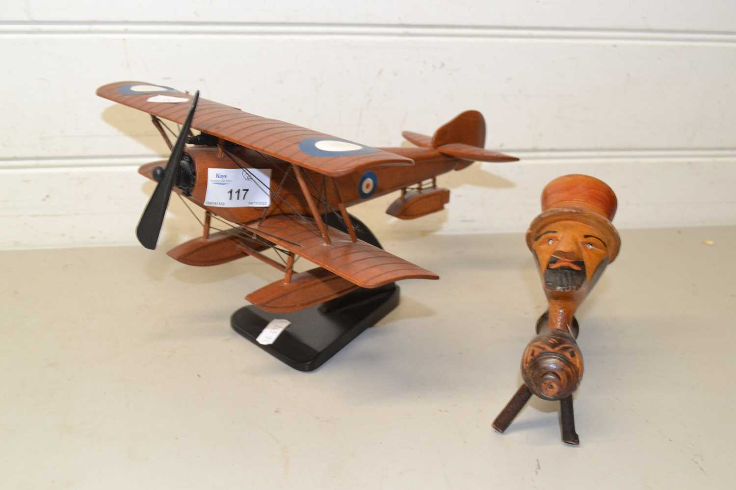Lot 117 Model plane and figural tobacco pipe