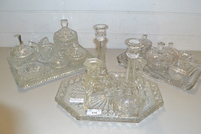 Lot 175 - Three various glass dressing table sets