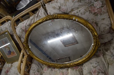 Lot 315 - 19th Century oval bevelled wall mirror in gilt...