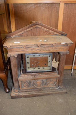 Lot 832 - 20th Century mantel clock set in a large oak...