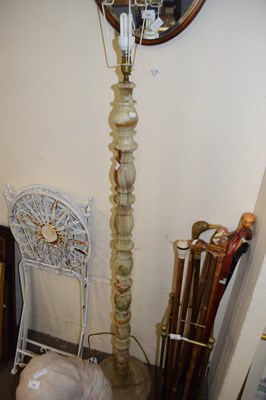 Lot 756 - Polished onyx standard lamp