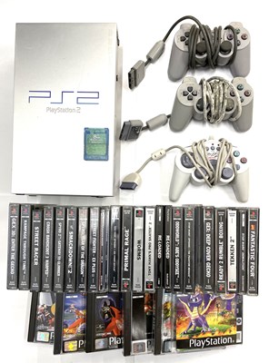 Lot 221 - An unboxed Sony Playstation 2 console in...