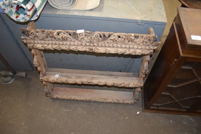 Lot 799 - Carved wooden wall shelf with floral...