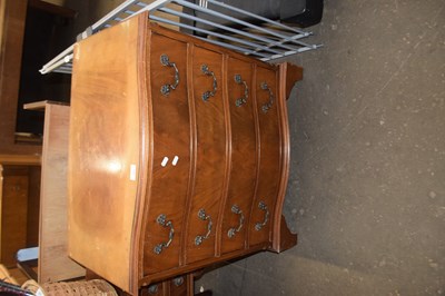 Lot 885 - Mahogany veneered serpentine front four drawer...