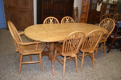 Lot 353 - Modern pine kitchen table and six wheel back...